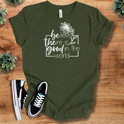 Soft-cream t-shirt with '' text, flat lay styled on a wooden surface.