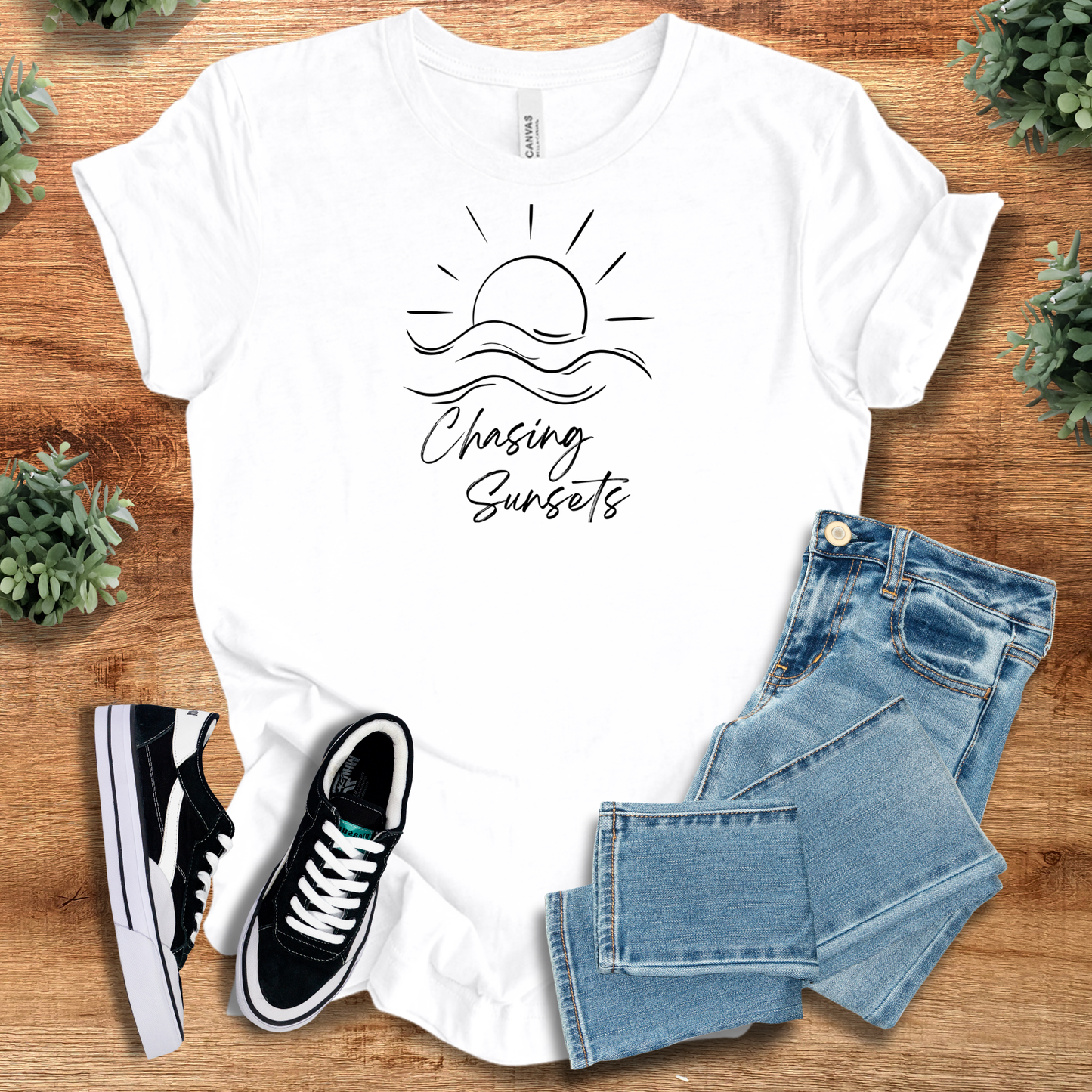 Chasing Sunsets T‑Shirt in white Bella+Canvas 3001, styled with jeans and sneakers. Minimalist nature-themed soft unisex tee with sunset design.