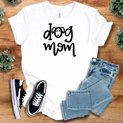 Heather-mauve t-shirt with '' text, flat lay styled on a wooden surface.