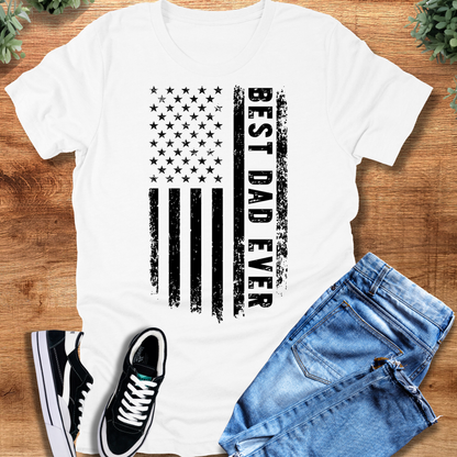 Black t-shirt with '' text, flat lay styled on a wooden surface.