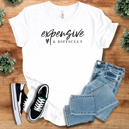 Heather-aqua t-shirt with '' text, flat lay styled on a wooden surface.