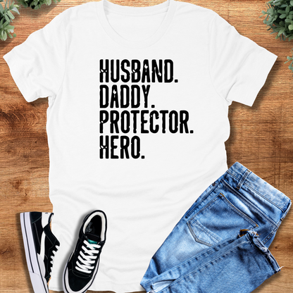 Heather-navy t-shirt with '' text, flat lay styled on a wooden surface.