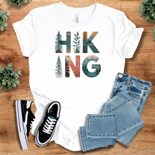 Hiking Elements Tee - Outdoor Adventures T-Shirt in white with scenic nature-themed lettering, ideal for hikers and nature lovers.