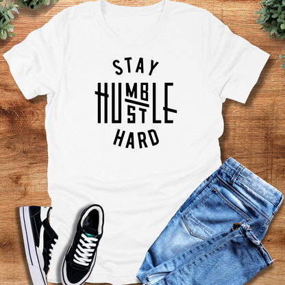 Black t-shirt with '' text, flat lay styled on a wooden surface.