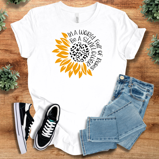 Be a Sunflower motivational t-shirt in white with bold sunflower graphic and uplifting quote. 100% cotton, casual fit for positive daily wear.