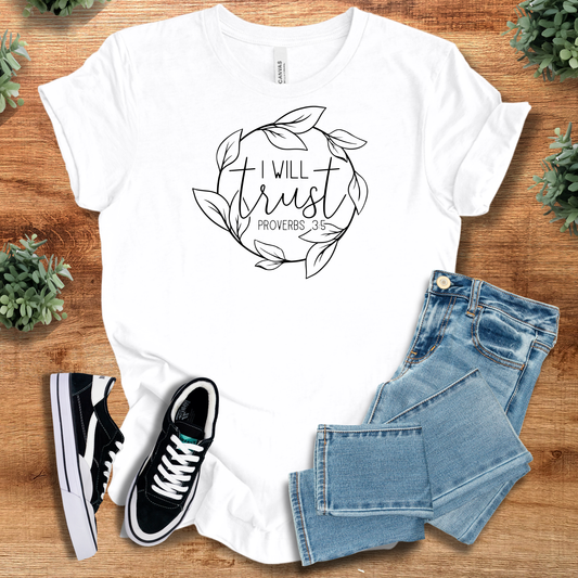 White Trust Proverbs 3:5 Tee with floral wreath and scripture quote, styled with jeans and sneakers. Christian apparel with inspirational message.