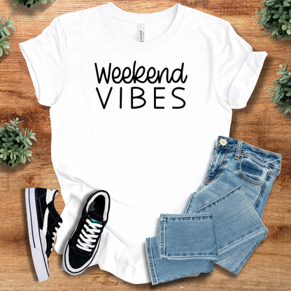 Heather-aqua t-shirt with '' text, flat lay styled on a wooden surface.