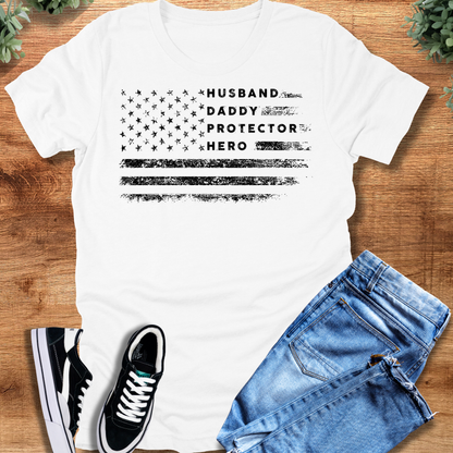 Heather-navy t-shirt with '' text, flat lay styled on a wooden surface.