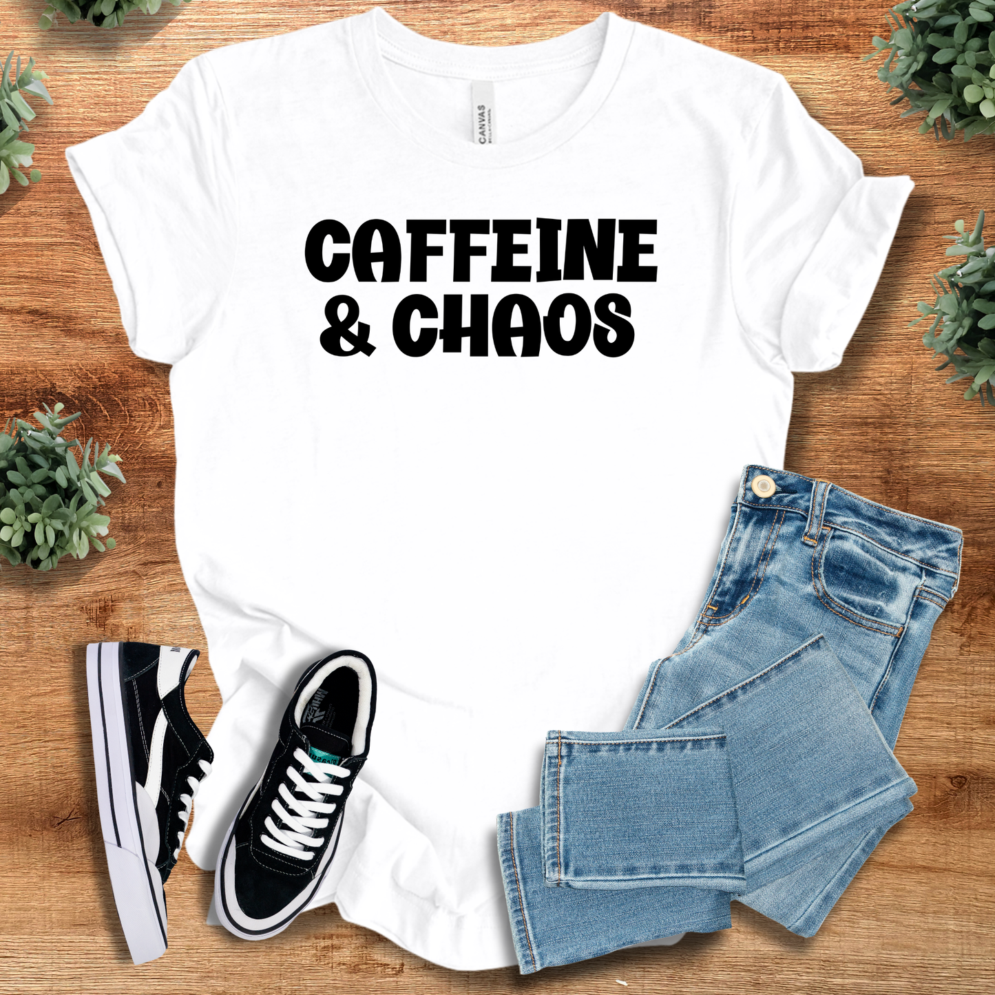 Heather-navy t-shirt with '' text, flat lay styled on a wooden surface.