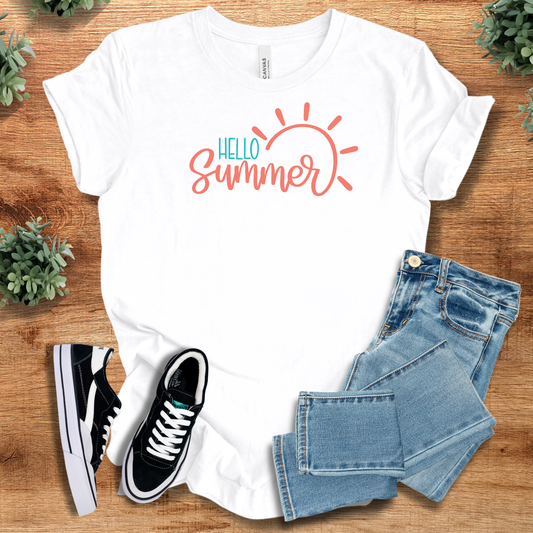 White Summer Vibes Tee with 'Hello Summer' graphic in coral and teal, styled with jeans and sneakers. Unisex cotton summer tee shirt.