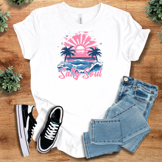 White Salty Soul Tee with pink sunset and palm tree graphic, made from Airlume cotton. Ideal beach lifestyle T-shirt for summer wardrobes.